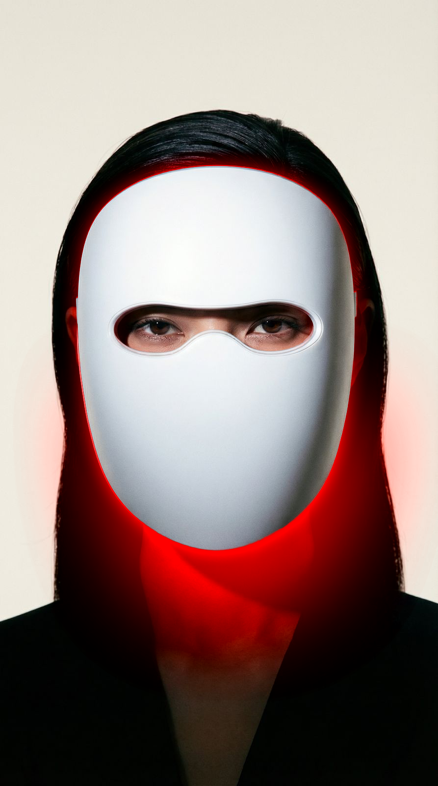 Woman with glowing skin after using the Lumière multi-light LED therapy mask