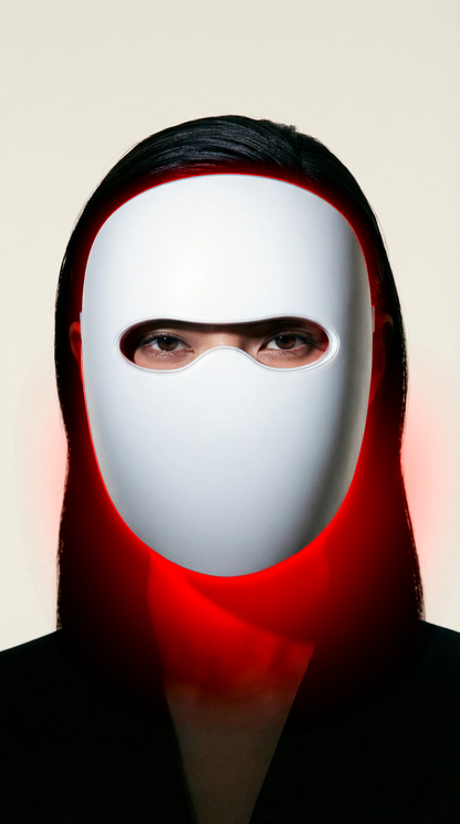 Woman with glowing skin after using the Lumière multi-light LED therapy mask